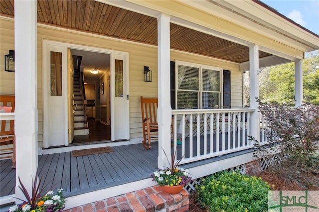 doorway to property with covered porch