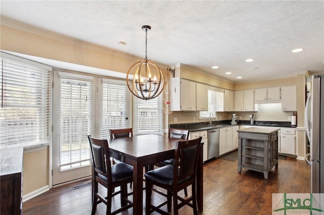 dining room featuring dark wood-style floors and ornamental molding