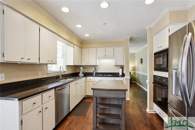 kitchen with black appliances, crown molding, dark wood-style flooring, and a sink