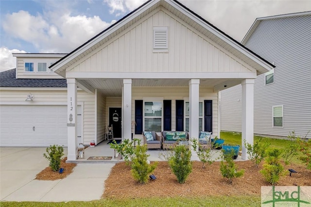 view of front of house featuring an attached garage, concrete driveway, a porch, and a shingled roof