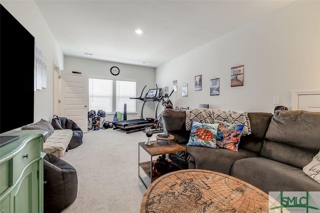 living room featuring carpet floors and visible vents