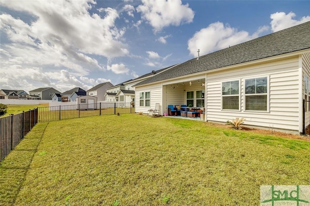 view of yard with a fenced backyard, a residential view, and a patio