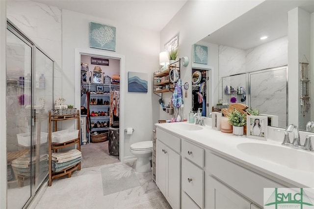 full bathroom featuring a shower stall and a sink