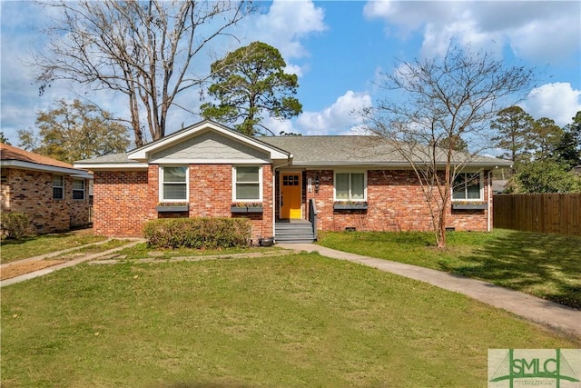 ranch-style home featuring a front yard, crawl space, brick siding, and fence