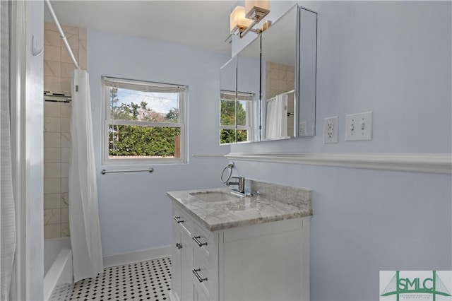 full bathroom featuring baseboards, vanity, and shower / bathtub combination with curtain