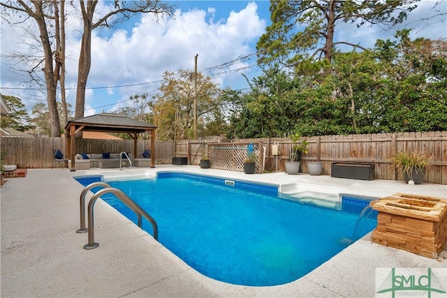 view of swimming pool with a fenced backyard, a gazebo, an outdoor living space, and a patio area