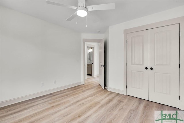 unfurnished bedroom with baseboards, ceiling fan, a closet, and light wood-style floors