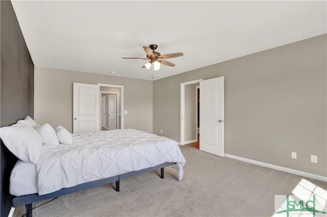 bedroom featuring carpet, baseboards, and a ceiling fan