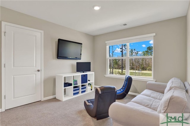 living room featuring baseboards, visible vents, and carpet flooring