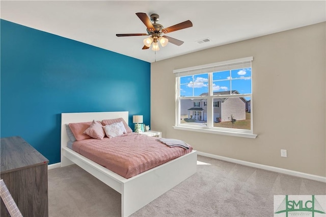 bedroom featuring carpet, visible vents, ceiling fan, and baseboards