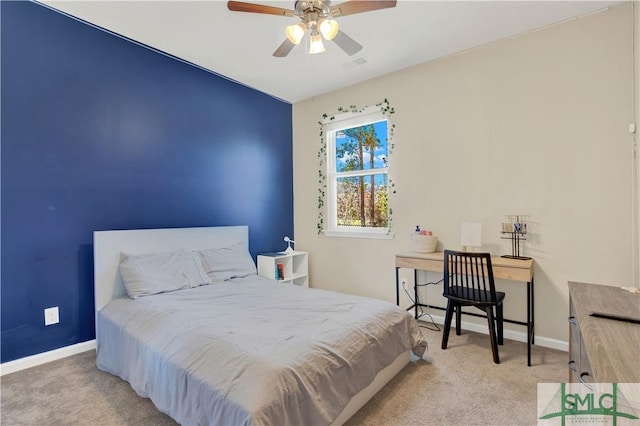 carpeted bedroom featuring visible vents and baseboards