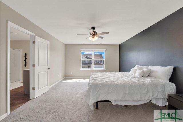 carpeted bedroom featuring ceiling fan and baseboards