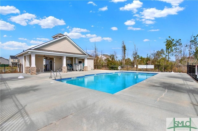 pool featuring ceiling fan, a patio, and fence