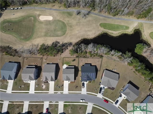 birds eye view of property with view of golf course and a residential view