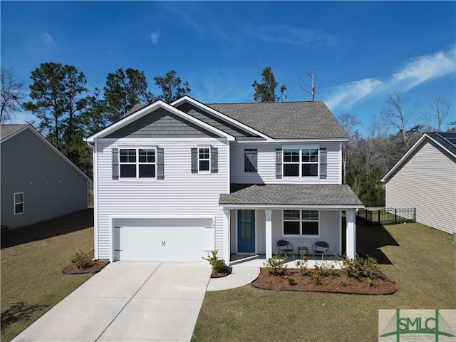 traditional-style home with driveway, a shingled roof, an attached garage, a porch, and a front yard