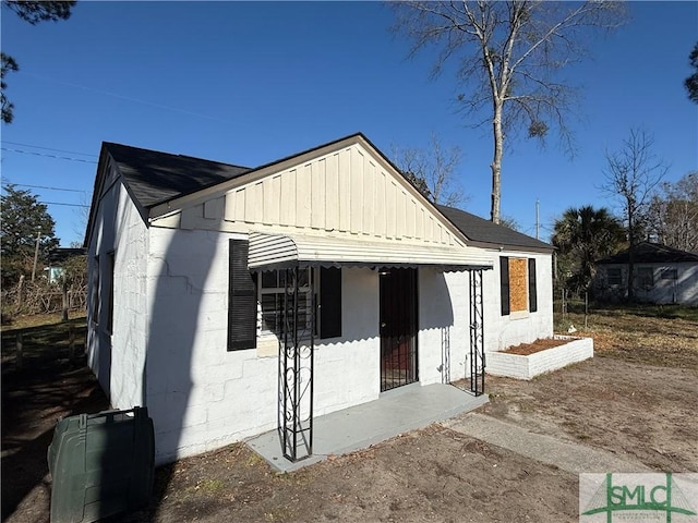 exterior space featuring concrete block siding