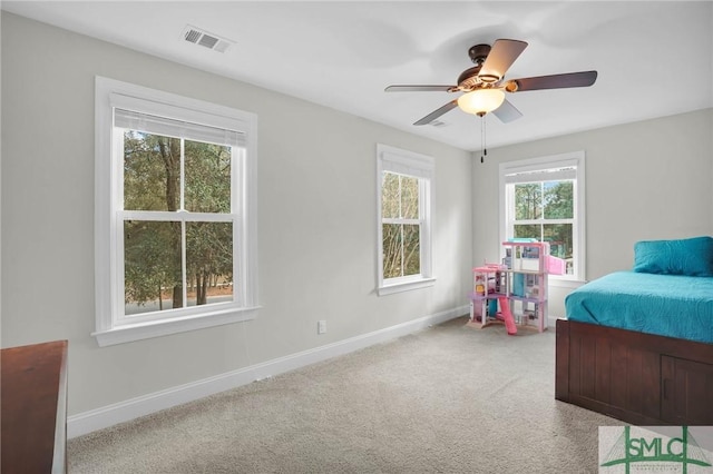 bedroom featuring baseboards, visible vents, ceiling fan, and carpet flooring