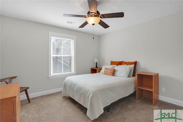 bedroom with ceiling fan, carpet flooring, visible vents, and baseboards