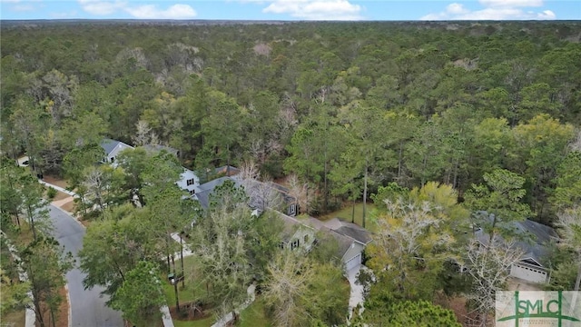 aerial view featuring a view of trees