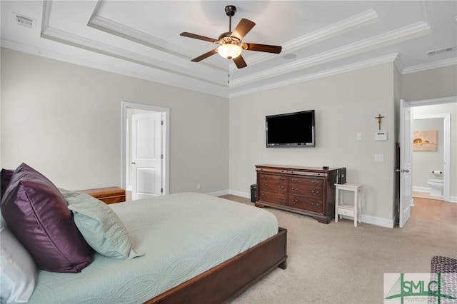 bedroom featuring crown molding, a raised ceiling, light colored carpet, visible vents, and baseboards