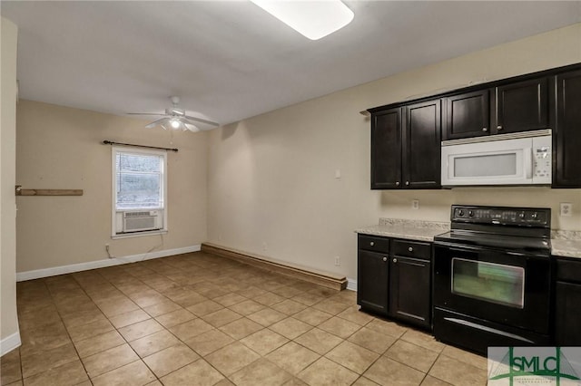 kitchen with white microwave, black / electric stove, light countertops, dark cabinetry, and cooling unit