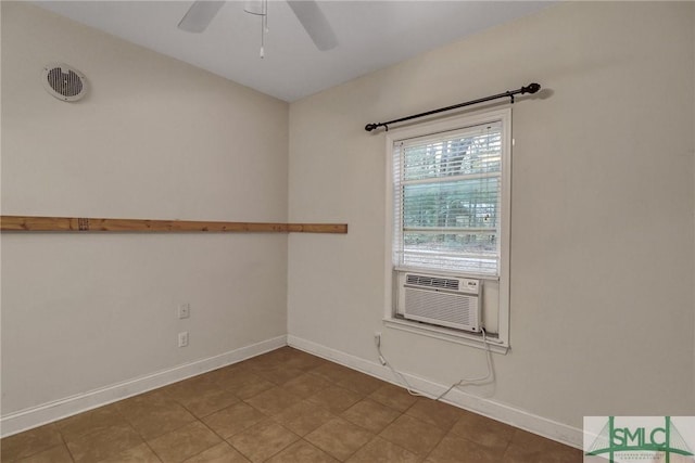 spare room featuring visible vents, cooling unit, a ceiling fan, and baseboards