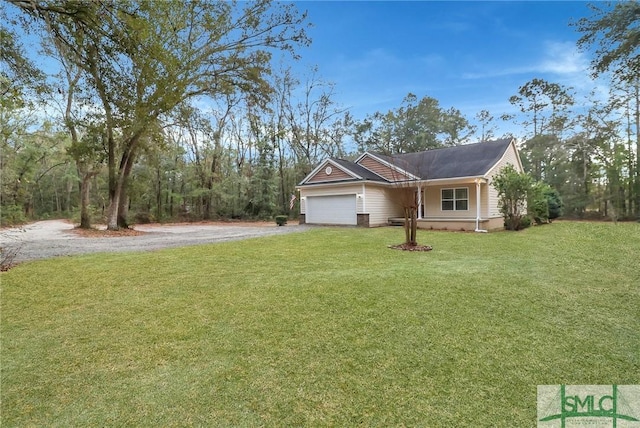 single story home featuring an attached garage, aphalt driveway, and a front yard