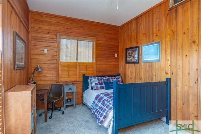 bedroom featuring carpet floors and wood walls