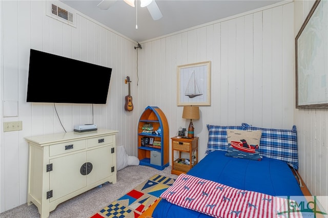 bedroom featuring ceiling fan, visible vents, and light colored carpet