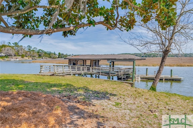 dock area featuring a yard and a water view