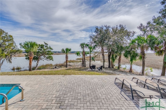 view of patio featuring a water view