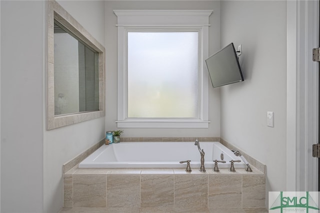 bathroom with a garden tub