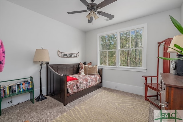 bedroom with carpet, visible vents, and baseboards