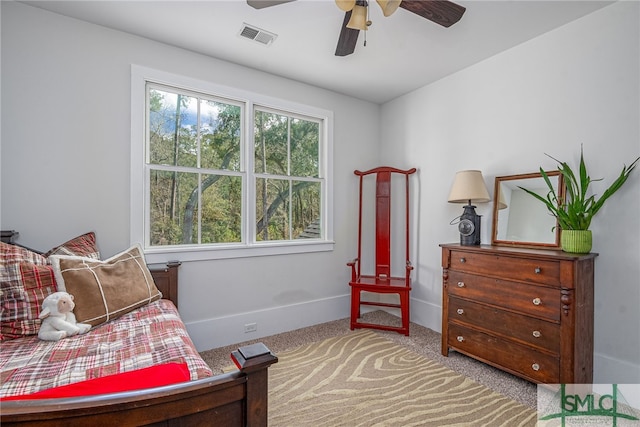 bedroom featuring ceiling fan, carpet floors, visible vents, and baseboards