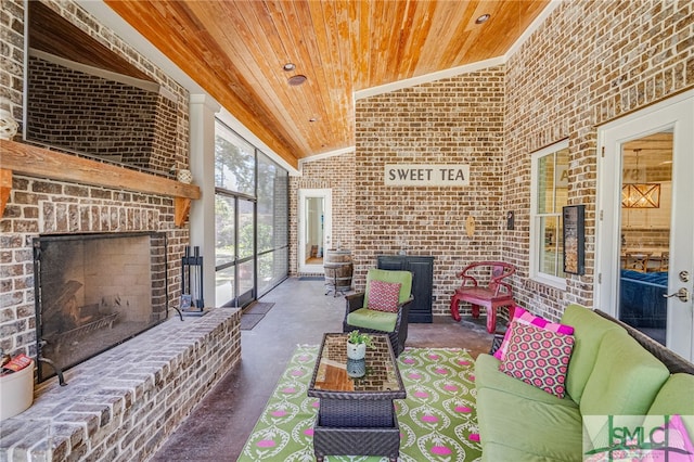 view of patio / terrace with an outdoor living space with a fireplace