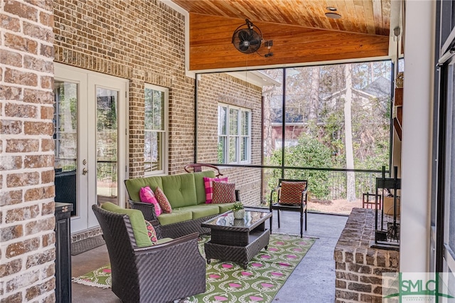 sunroom / solarium with wooden ceiling and vaulted ceiling