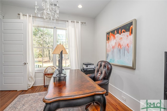 home office with recessed lighting, an inviting chandelier, baseboards, and wood finished floors