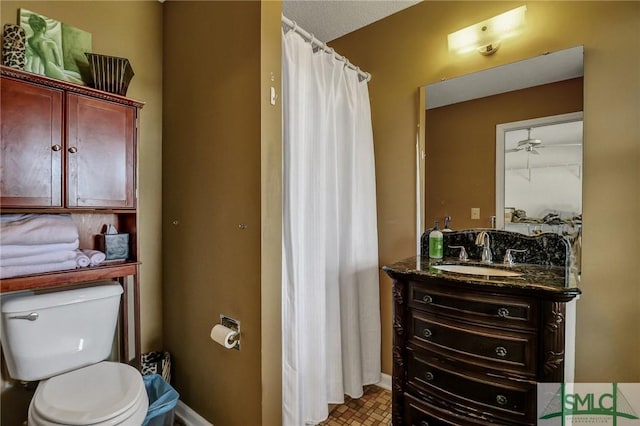 126 Grove Point Island Rd, Savannah, GA 31419 - bathroom with toilet, vanity, a shower with curtain, and baseboards