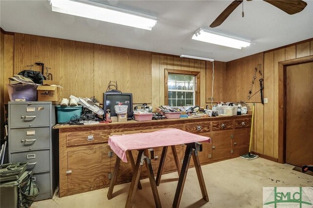 126 Grove Point Island Rd, Savannah, GA 31419 - kitchen with brown cabinets, wood walls, and a ceiling fan