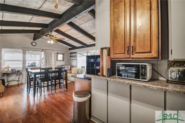126 Grove Point Island Rd, Savannah, GA 31419 - kitchen featuring dark wood-style floors, a ceiling fan, and brown cabinetry
