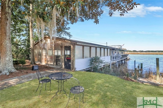 126 Grove Point Island Rd, Savannah, GA 31419 - dock area featuring an outdoor fire pit, a lawn, and a water view