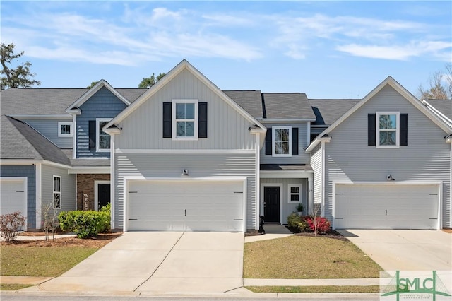 view of front of house with a garage, board and batten siding, and concrete driveway