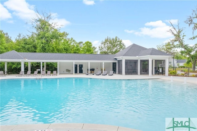 pool featuring a patio and fence