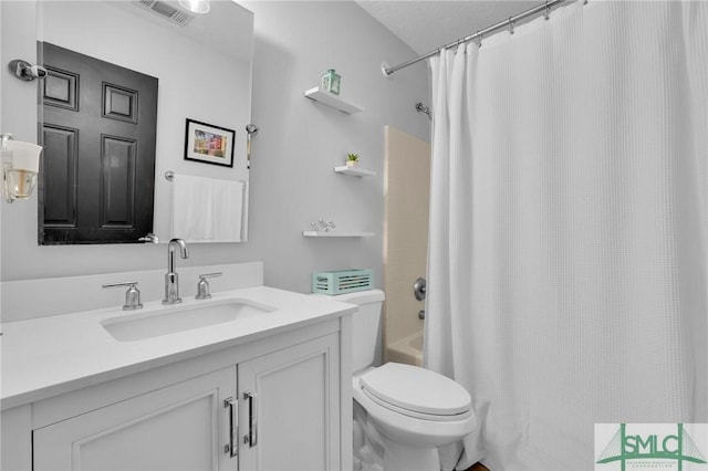 full bathroom featuring toilet, vanity, visible vents, and shower / bathtub combination with curtain