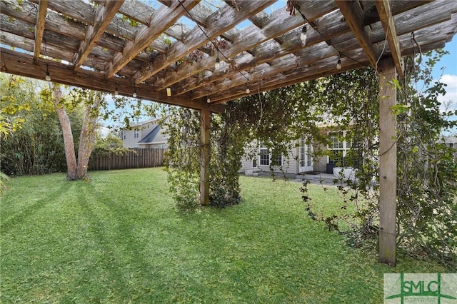 view of yard with fence and a pergola