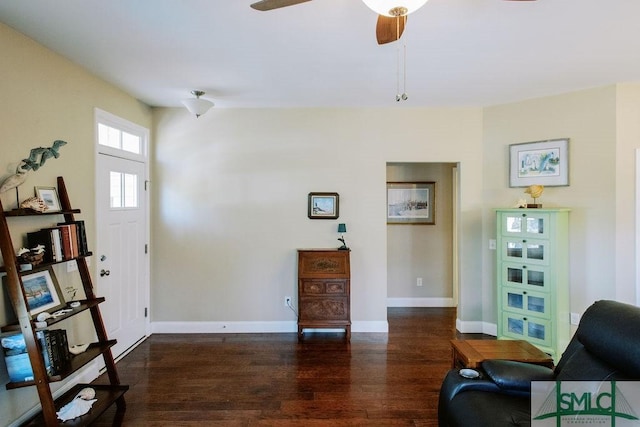 entryway with baseboards, dark wood finished floors, and a ceiling fan