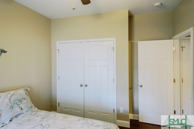 bedroom with a ceiling fan and a closet