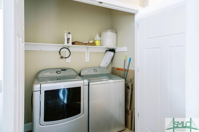 clothes washing area with laundry area and independent washer and dryer