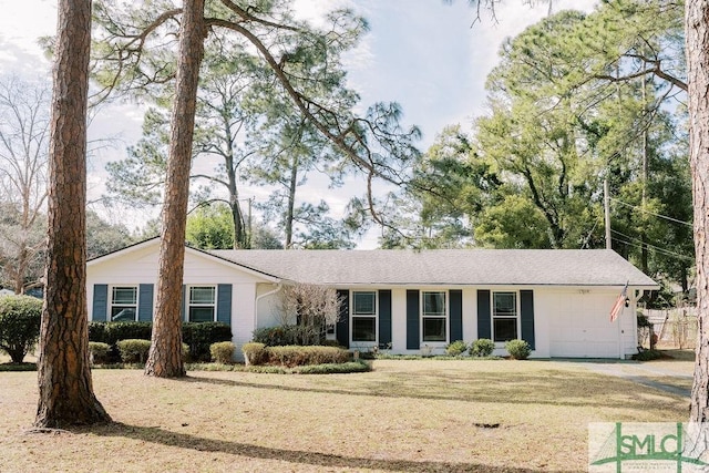 single story home with a front lawn and an attached garage