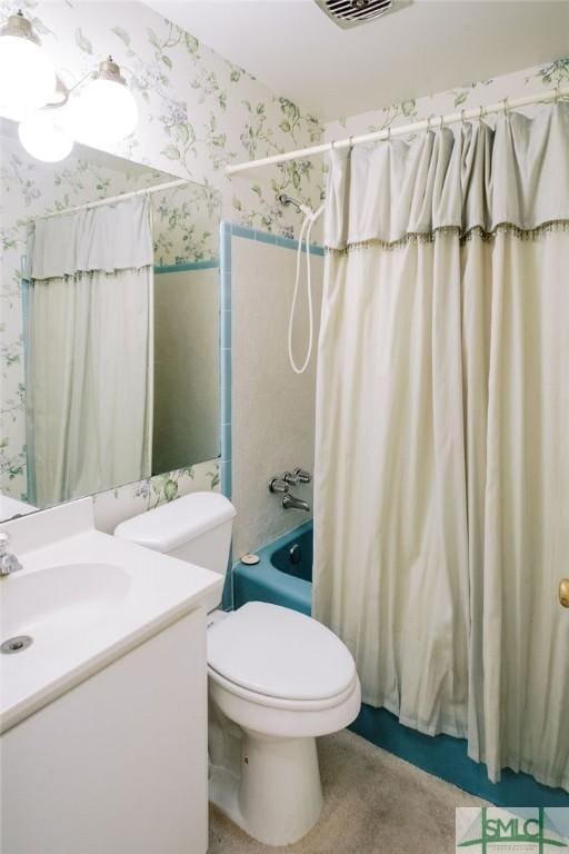 full bathroom featuring toilet, shower / bath combination with curtain, vanity, and wallpapered walls